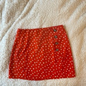 Lulu’s Red/orange Polka Dot Side-button skirt.